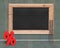 Blank blackboard with red percentage sign wood ladder