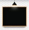 Blank blackboard in white brick wall background with hanging light