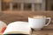 Blank booklet on wooden table with A cup of coffee