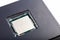 Blank brand new modern no name silver cpu processor die, chip plastic packed top lid view macro closeup, copy space for text, new