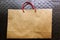 Blank brown paper carrier bag with handles for shopping
