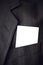 Blank business card in corporate suit pocket