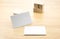 Blank business card on wood table with cube block,mock up template for adding design or text