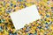 Blank Business Card on Yellow Sprinkles For Dessert Topping. Stationery Copy and Empty Space
