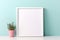 Blank Canvas: Empty Photo Frame on Desk Against a Serene Blue Pastel Wall, Awaiting Cherished Memories