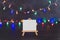 Blank canvas with multicolor festive string lights bokeh and copyspace