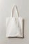 Blank canvas tote bag on a light grey background
