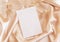 Blank card on beige silky fabric drapery  top view, greeting or wedding mockup