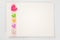 Blank card with colorful hearts over rose ribbon