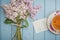 Blank card, english black tea and blooming lilac