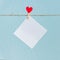 Blank cards on pins with red hearts. Mockup for text and blue background for Valentines Day greetings