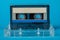 Blank cassette tape box with retro cassette on blue background