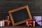 blank chalkboard in frame with various gift boxes