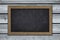 Blank  chalkboard on wooden wall background