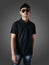 Blank collared shirt mock up template, front view, Asian male teenage model wearing plain black t-shirt. Polo tee design mockup