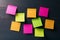 Blank colorful sticky notes on wooden background