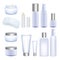 Blank cosmetic tubes and jars on white background.