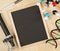 Blank, empty, black chalkboard with microscope, molecule model, pen and DNA model flat lay on brown wooden desk