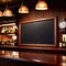 Blank, empty blackboard sign on wall behind bar in restaurant