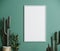 Blank frame on green wall mock up with cactus, vertical white poster frame on wall, mock up for picture or photo frame, empty