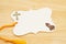 Blank gift tag with yellow ribbon praying hands and cross on wood desk