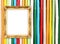 Blank golden frame on colorful bamboo wall