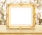Blank golden vintage photo frame with sparkling gold bokeh wall