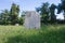 Blank Grave Stone in Grassy Graveyard