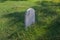 Blank Grave Stone in Grassy Graveyard on an Angle