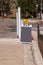 Blank gray sandwich type chalk board on a street with a yellow flag