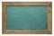 Blank green chalk board with wooden frame,  on white background. Chalkboard surface texture with sharp detailed grainy cha