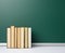 Blank green chalk school board and stack of books