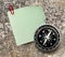 Blank green sticker and compass
