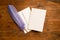 Blank Greeting or Invitation Card and Purple Quill