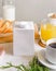 Blank half liter milk box tetra pack  with lid on a table with breakfast. package template, mockup of a retail container for