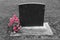 Blank headstone with pink flowers