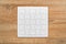 Blank jigsaw puzzle on wooden table
