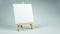 Blank mini canvas on mini canvas with wooden easel stand