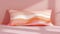 Blank mockup of a rectangular body pillow with a striped abstract design in shades of pink and orange.