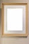 Blank modern wooden picture frame on wall