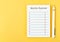 The Blank Monthly expenses planning checklist with pen on yellow background. For your text