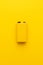 Blank nine-volt battery on the yellow background