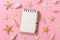 Blank note book with starfish or seashells on a pink background , summer vaction concept