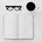 Blank notebook, eyeglasses and cup of coffee on a white table