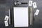 Blank notebook, fingerprint, magnifying glass, pencils and other tools for criminal investigation