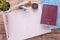 Blank notebook,passport,compass,airplane and map on wooden table