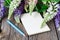 Blank notebook with pen and bouquet of flowers wooden table. diary writing concept