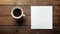 Blank notepad flat lay design with coffee cup on wooden table