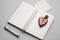 Blank open notepad, copywriting, human heart, red, generativ ai