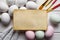 Blank paper sheet, colored and white eggs